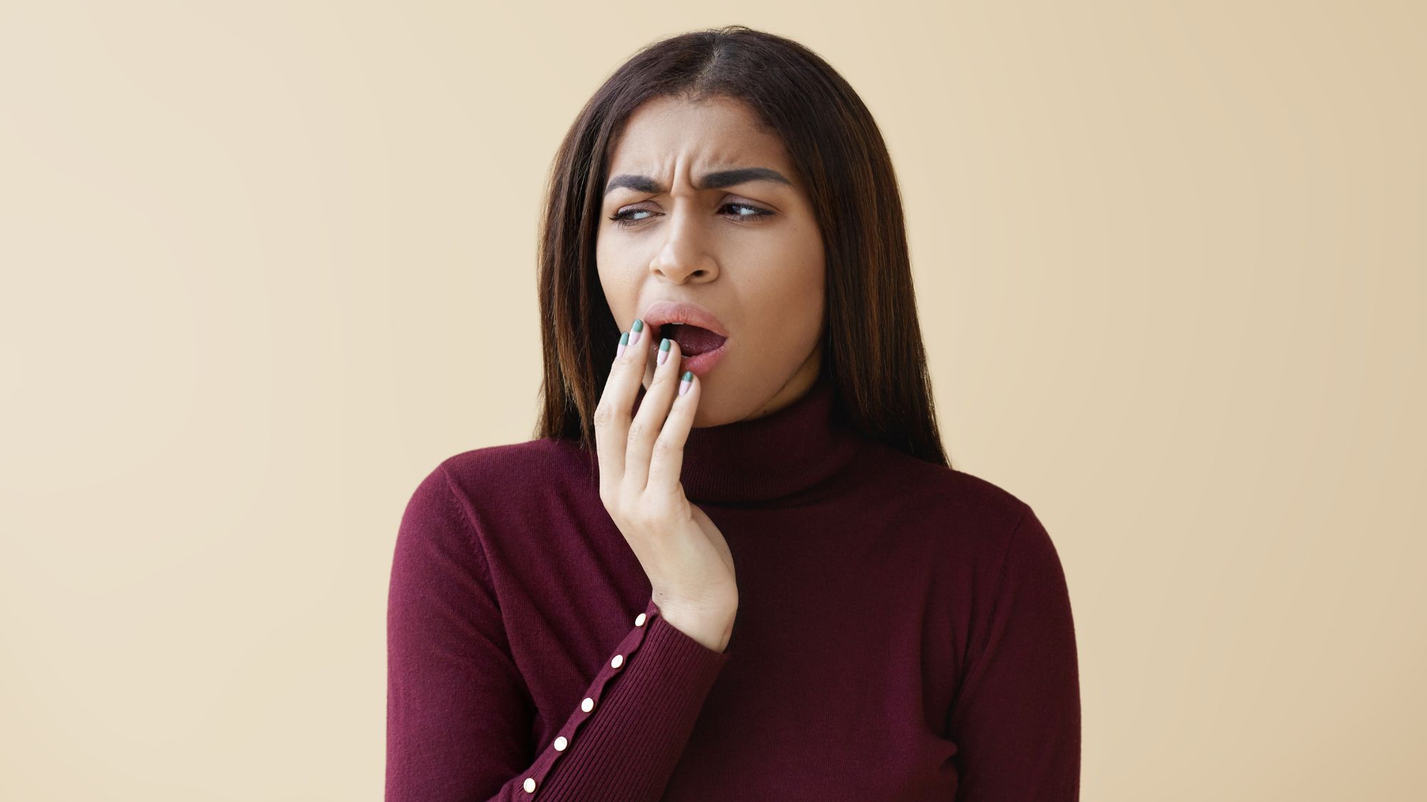 A woman suffering from gum swelling an gum bleeding problems